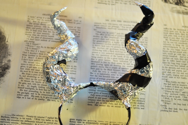 attach foil Maleficent horns with electrical tape and more foil